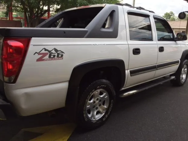 White Chevrolet Avalanche pickup truck after a hand wash